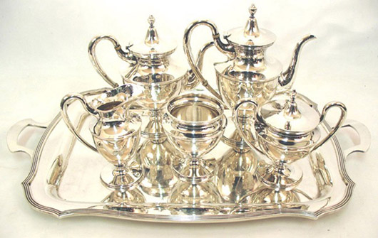 Stieff six-piece sterling silver tea and coffee service with ivory mountings on handles, bottom of tray inscribed with 1944 date, $4,600. Stephenson’s Auctioneers image.